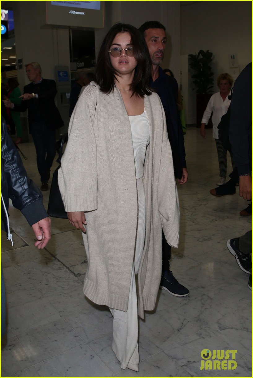selena gomez arrives at airport for cannes 14