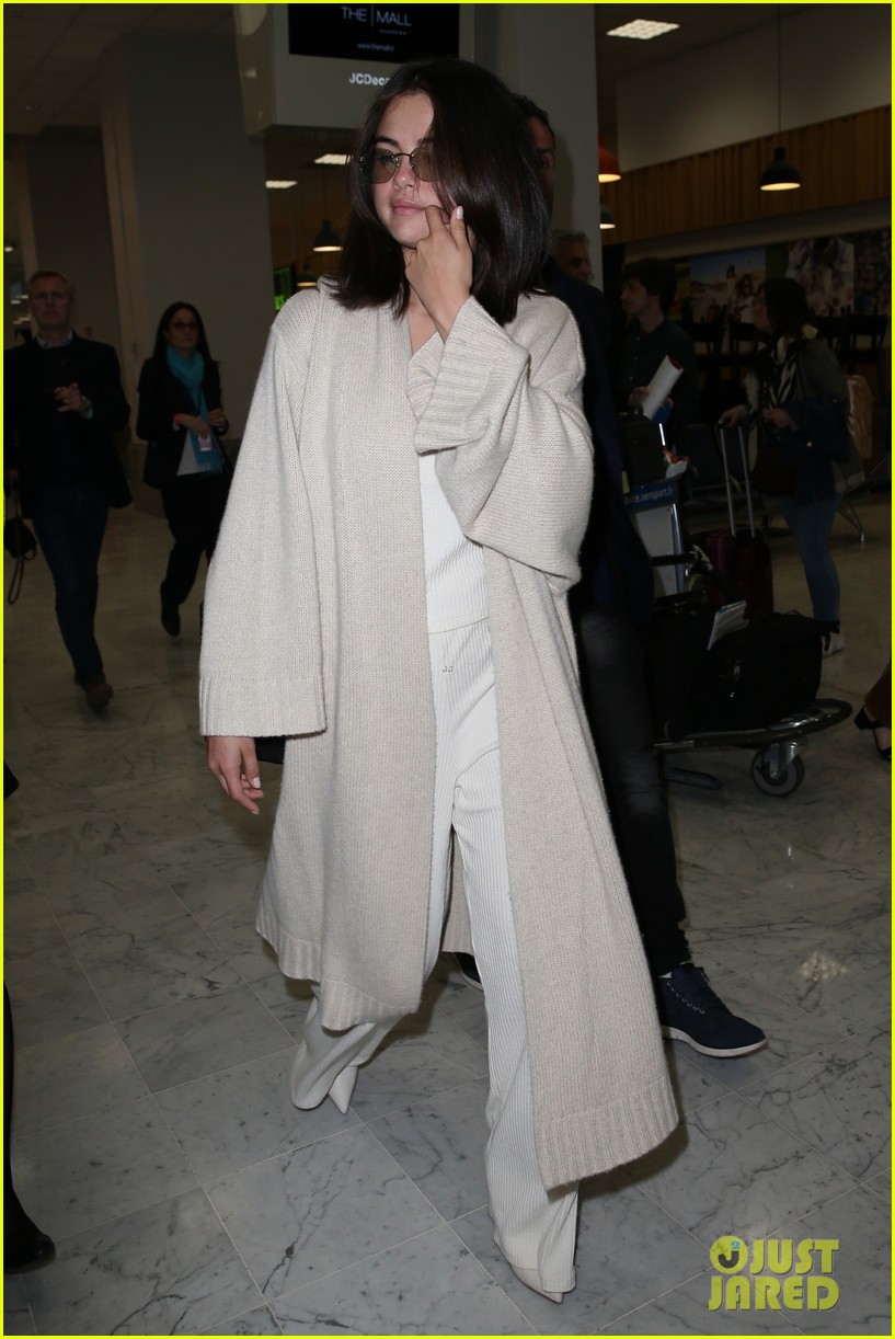 selena gomez arrives at airport for cannes 16