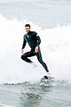 liam hemsworth strips out of his wetsuit after surfing 02