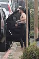 liam hemsworth strips out of his wetsuit after surfing 03