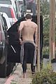 liam hemsworth strips out of his wetsuit after surfing 04