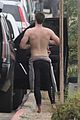 liam hemsworth strips out of his wetsuit after surfing 06