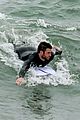 liam hemsworth strips out of his wetsuit after surfing 07