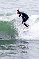 liam hemsworth strips out of his wetsuit after surfing 09