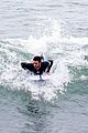 liam hemsworth strips out of his wetsuit after surfing 13