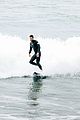 liam hemsworth strips out of his wetsuit after surfing 15