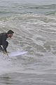 liam hemsworth strips out of his wetsuit after surfing 21