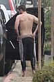 liam hemsworth strips out of his wetsuit after surfing 35