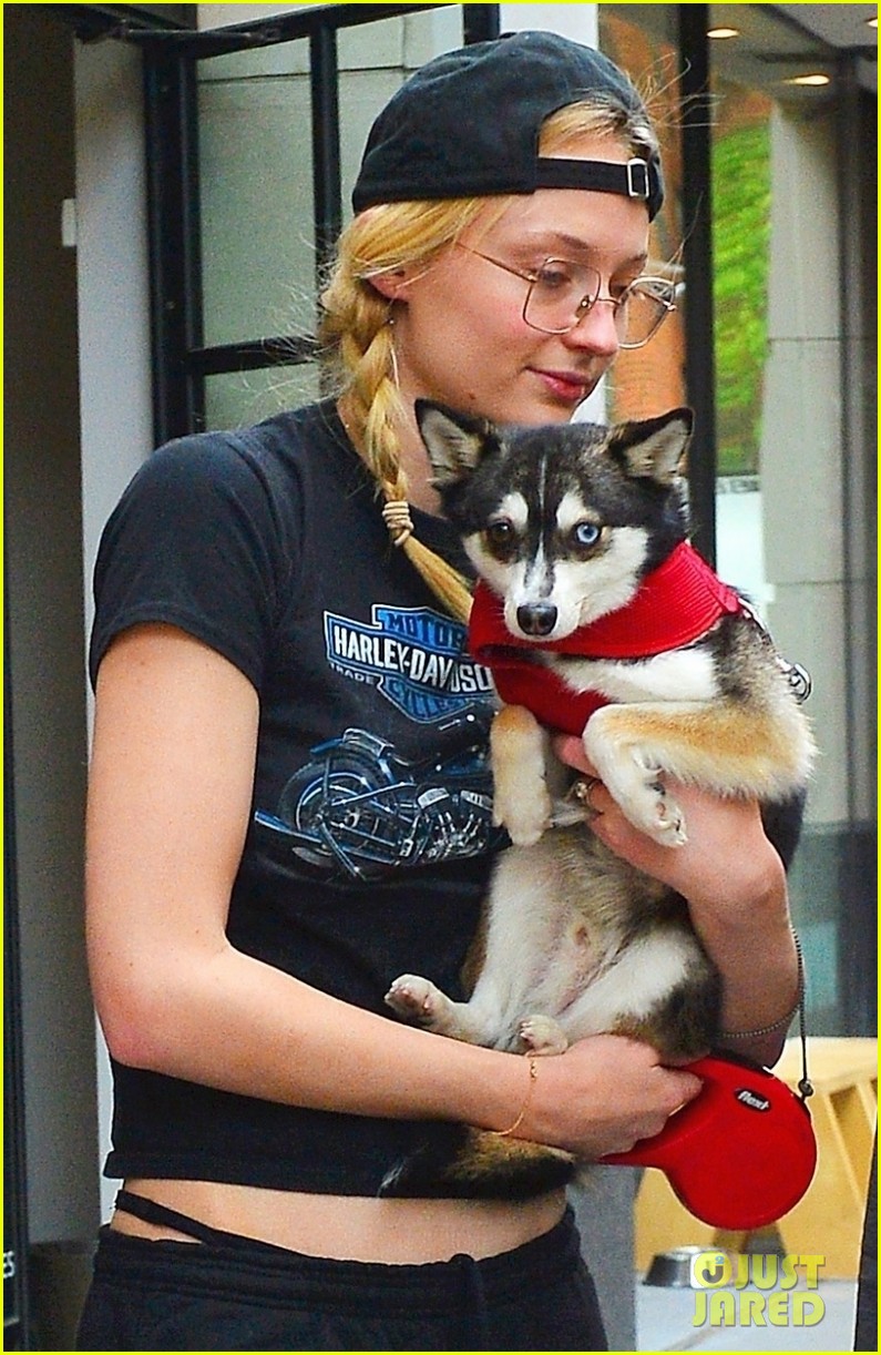 sophie turner cuddles one of her dogs while out in nyc 04