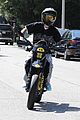 justin bieber popsa wheelie during his motorcycle ride 01