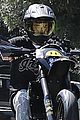 justin bieber popsa wheelie during his motorcycle ride 02