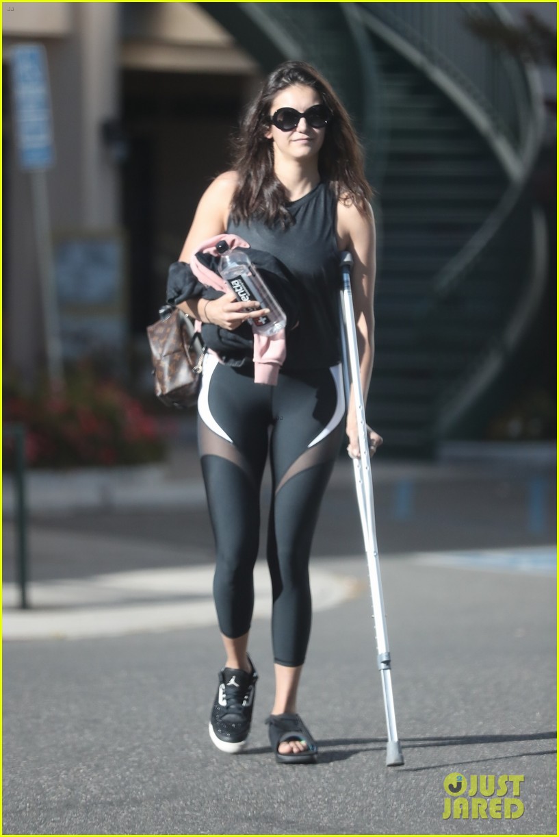 nina dobrev steps out on crutches after injuring her foot 03
