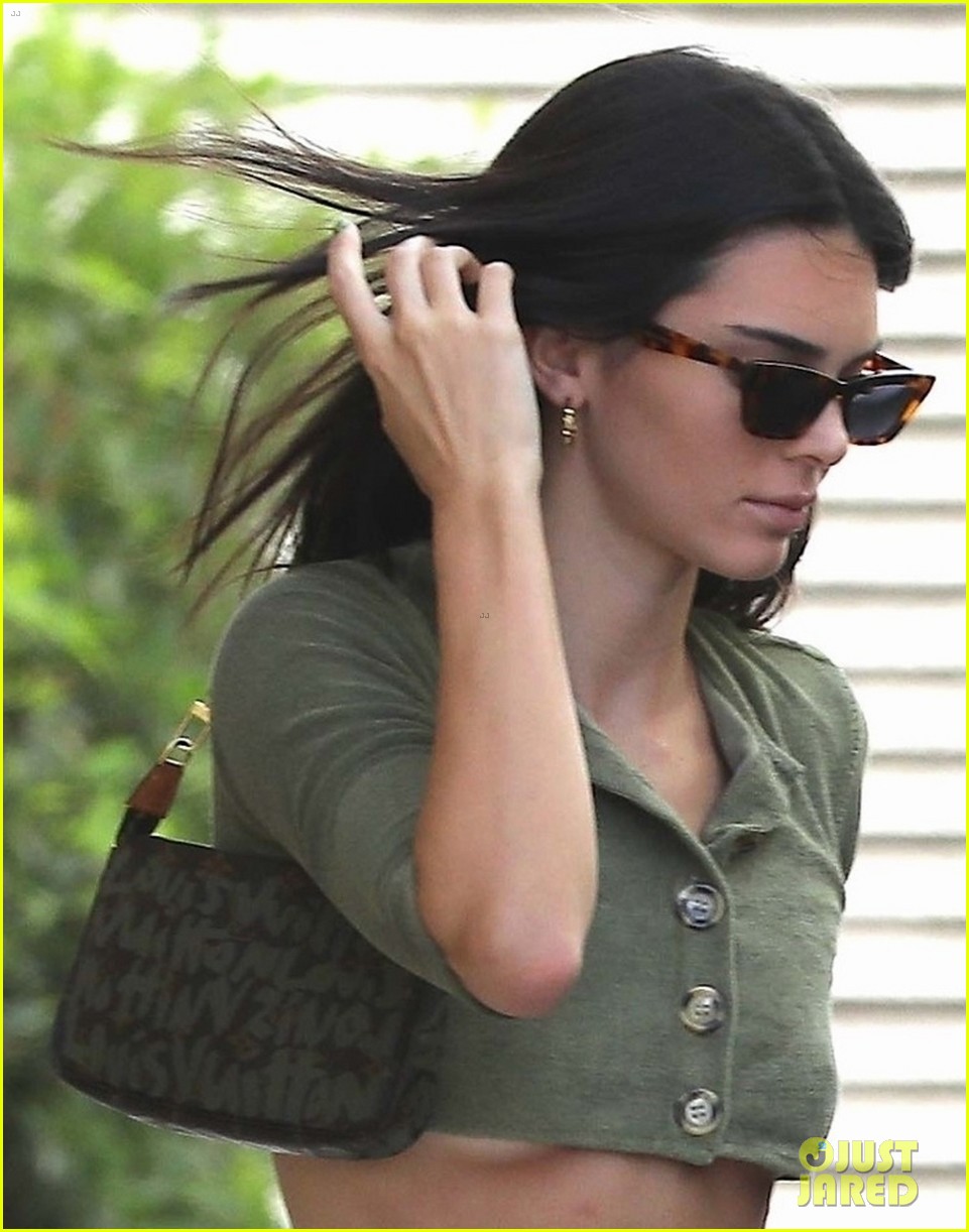 kendall jenner shows some skin in tiny green crop top 04