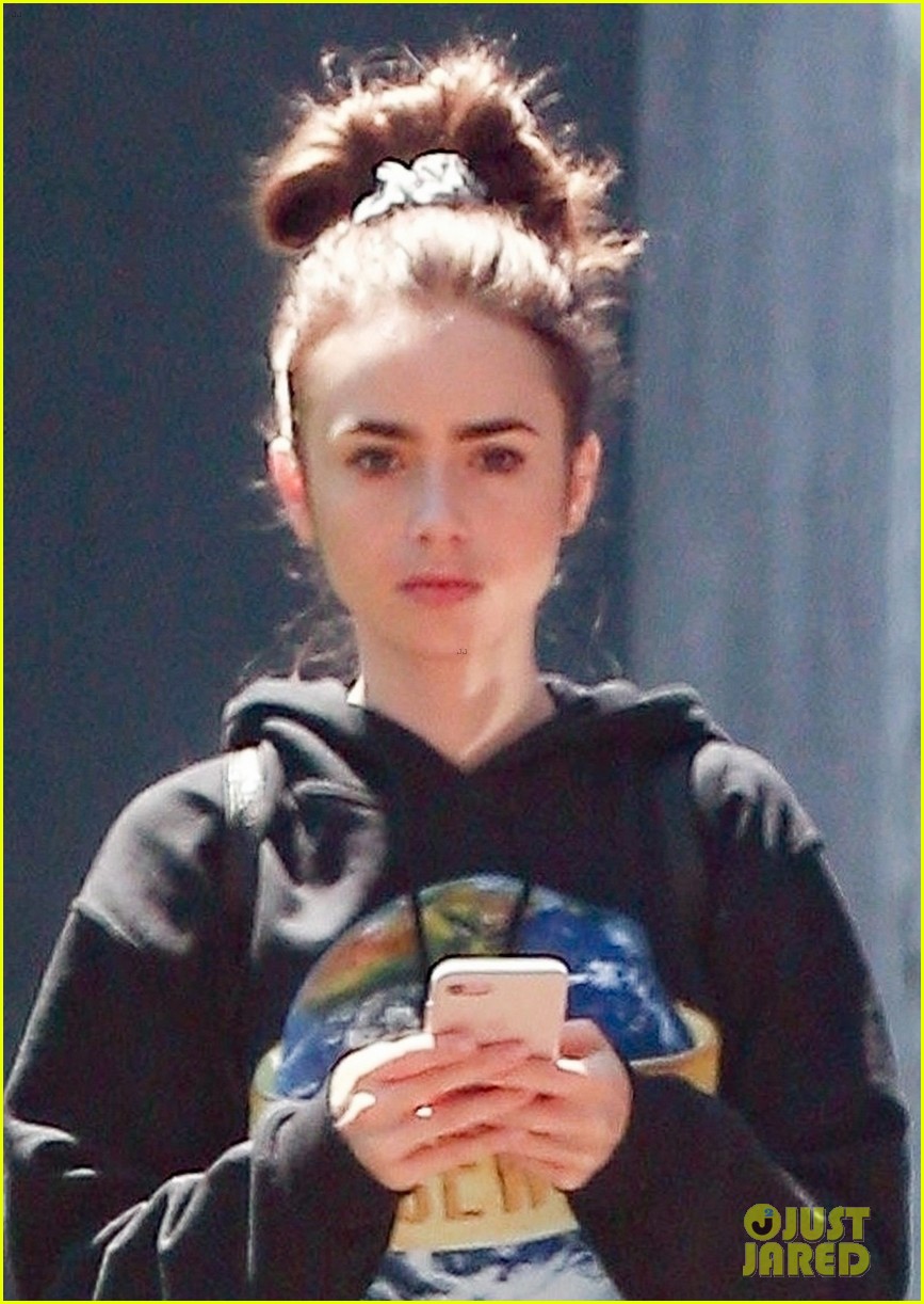 lily collins finds her own lancome ad in paris 03