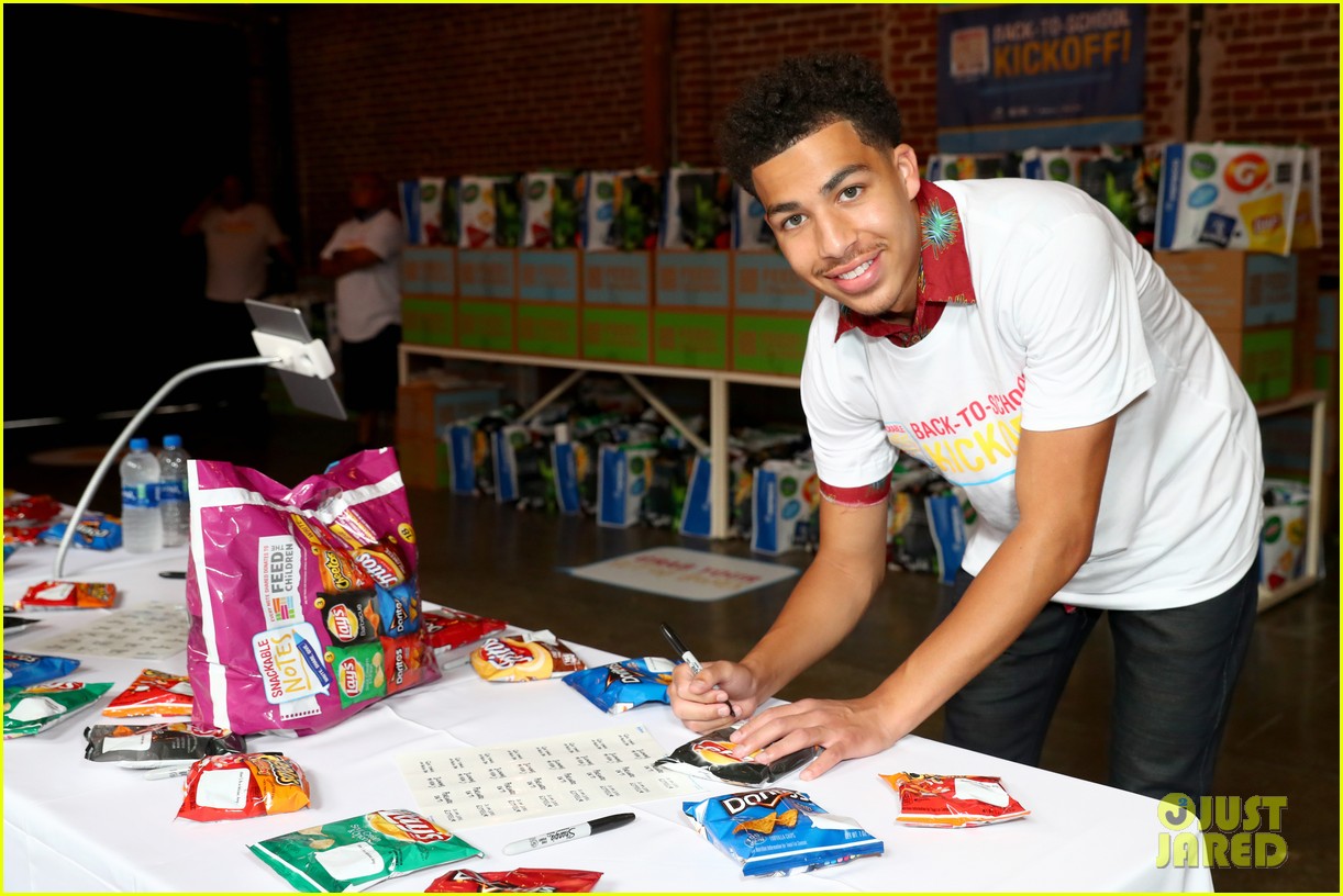marcus scribner helps hand out food to families in need 01