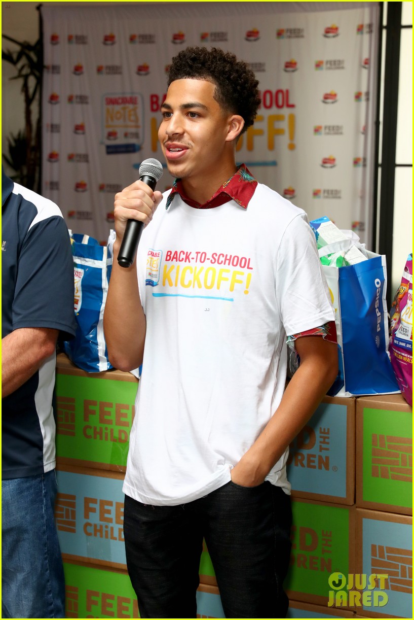 marcus scribner helps hand out food to families in need 03