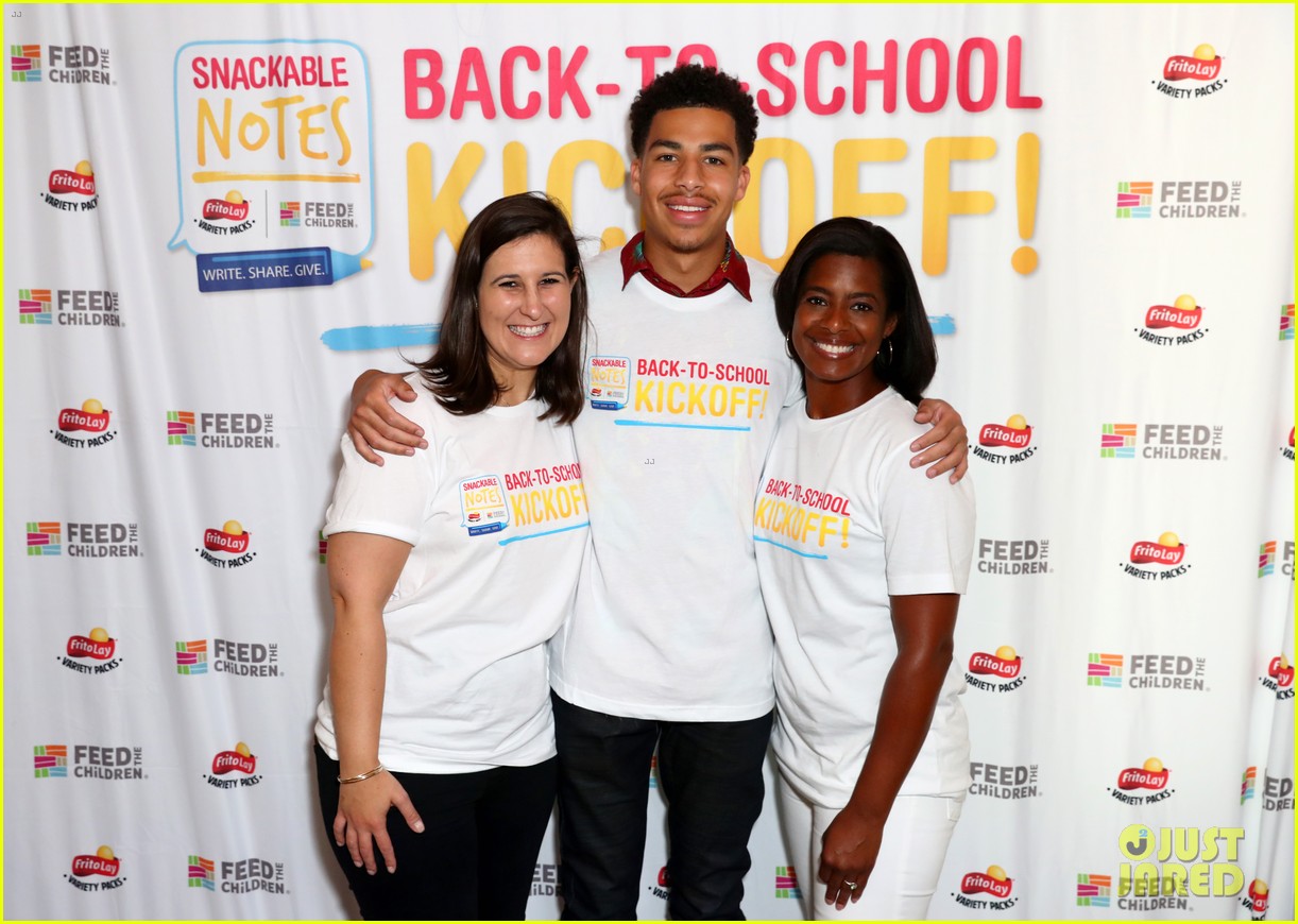 marcus scribner helps hand out food to families in need 05