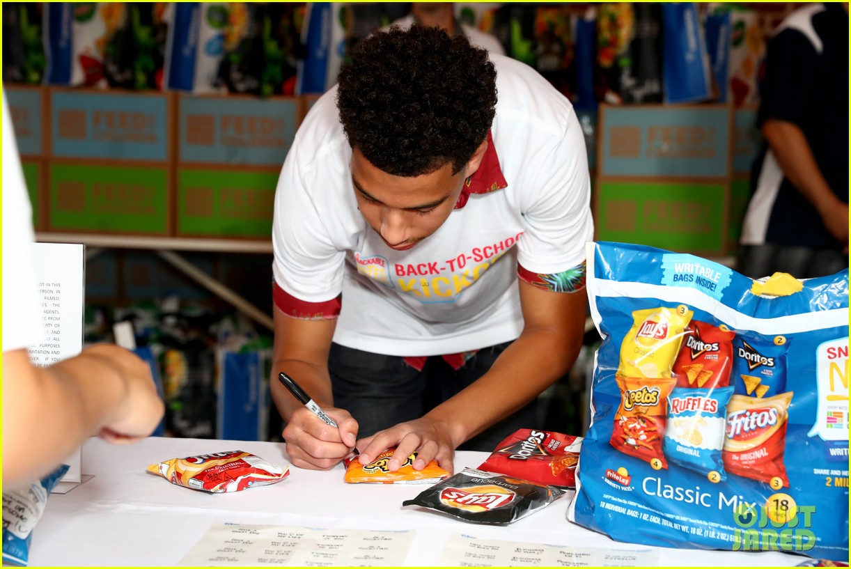 marcus scribner helps hand out food to families in need 09