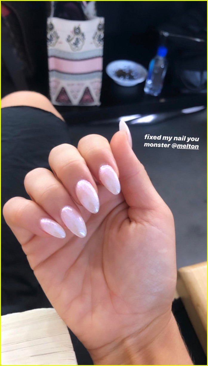 zoey deutch gets her nail fixed after charles melton bites it off 01