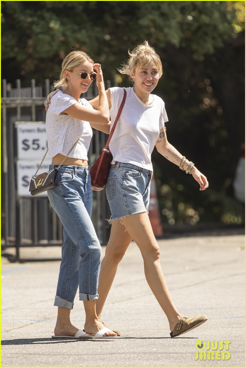 miley cyrus wraps her arms around kaitlynn carter during afternoon outing 02