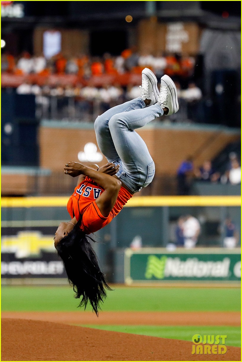 simone biles does backflip before throwing first pitch at world series game 02