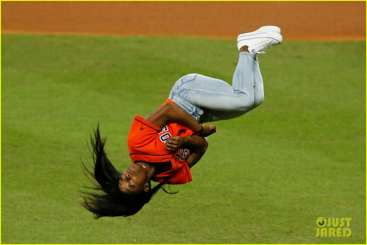 simone biles does backflip before throwing first pitch at world series game 06