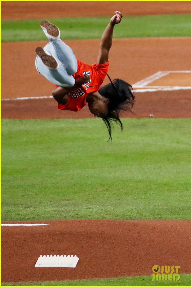 simone biles does backflip before throwing first pitch at world series game 10