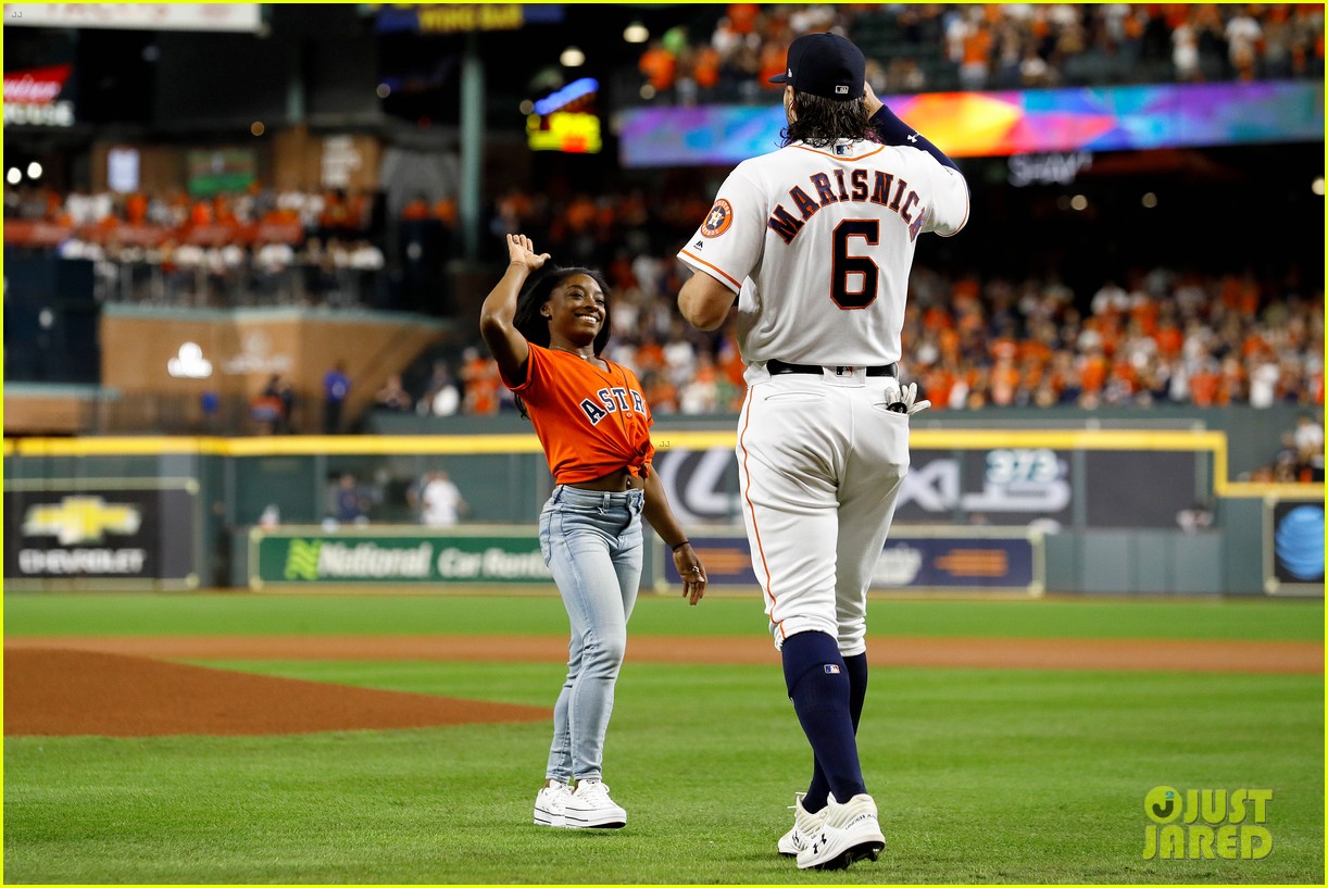 simone biles does backflip before throwing first pitch at world series game 12