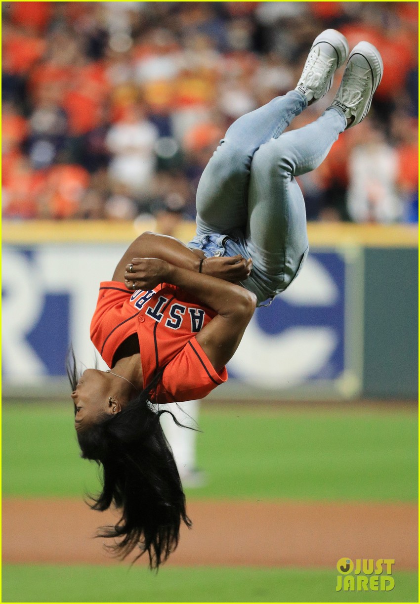 simone biles does backflip before throwing first pitch at world series game 15