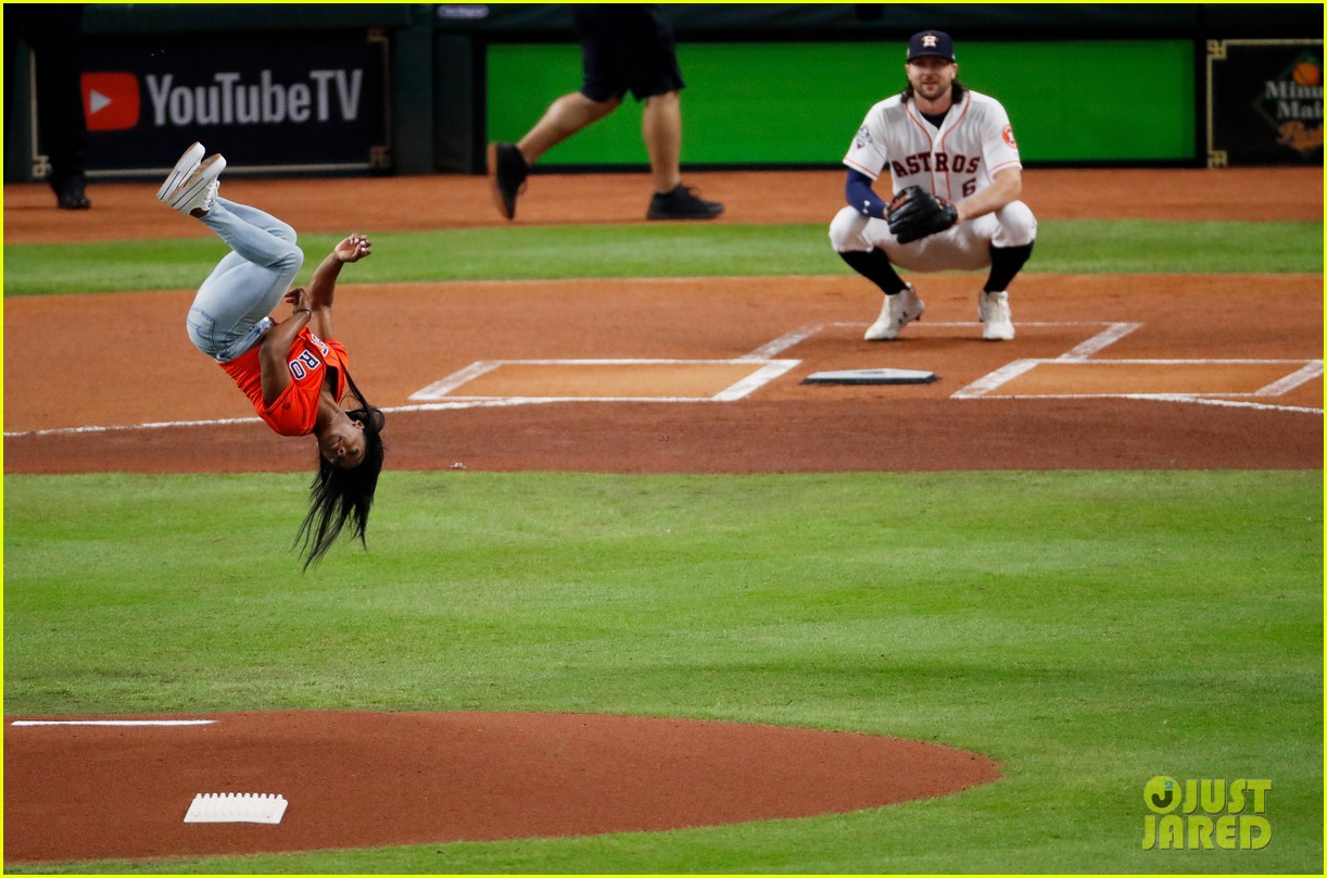 simone biles does backflip before throwing first pitch at world series game 16
