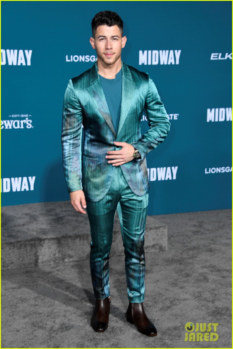 nick jonas sports silk teal suit for midway premiere 01
