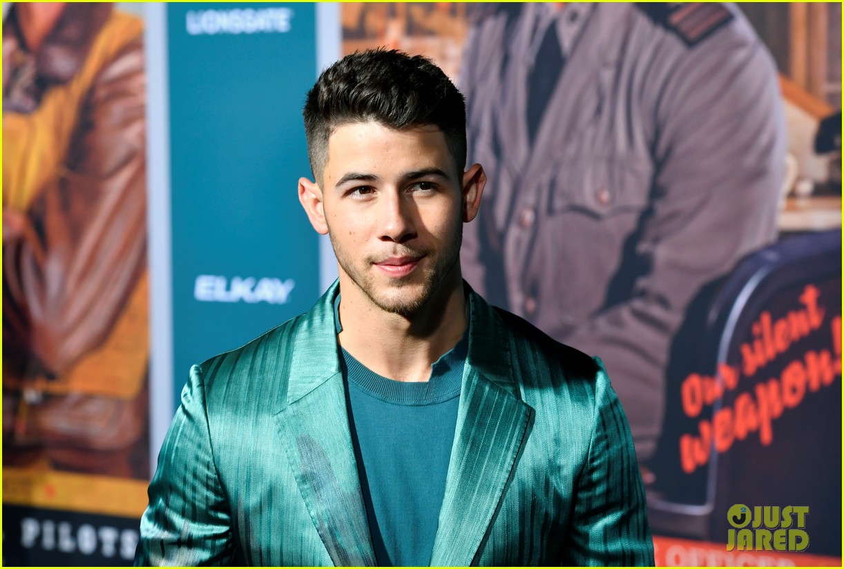 nick jonas sports silk teal suit for midway premiere 06