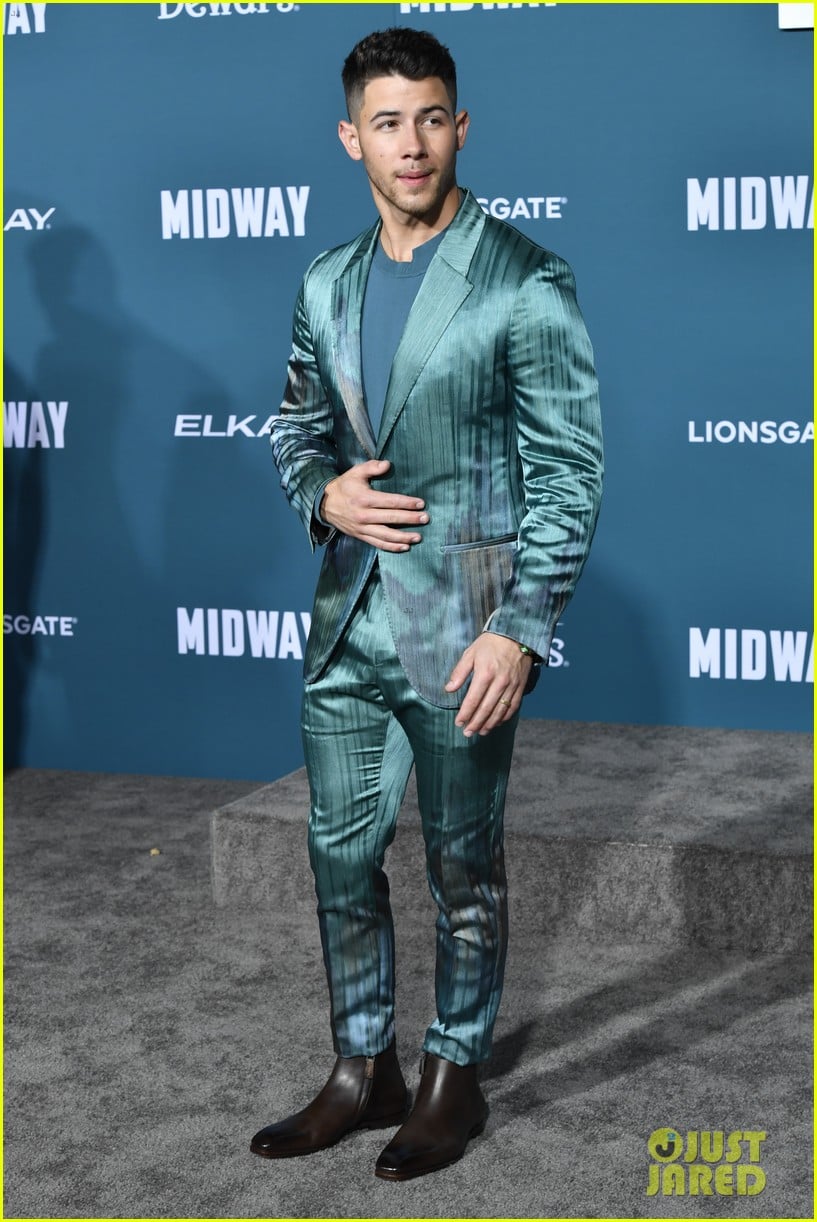 nick jonas sports silk teal suit for midway premiere 07