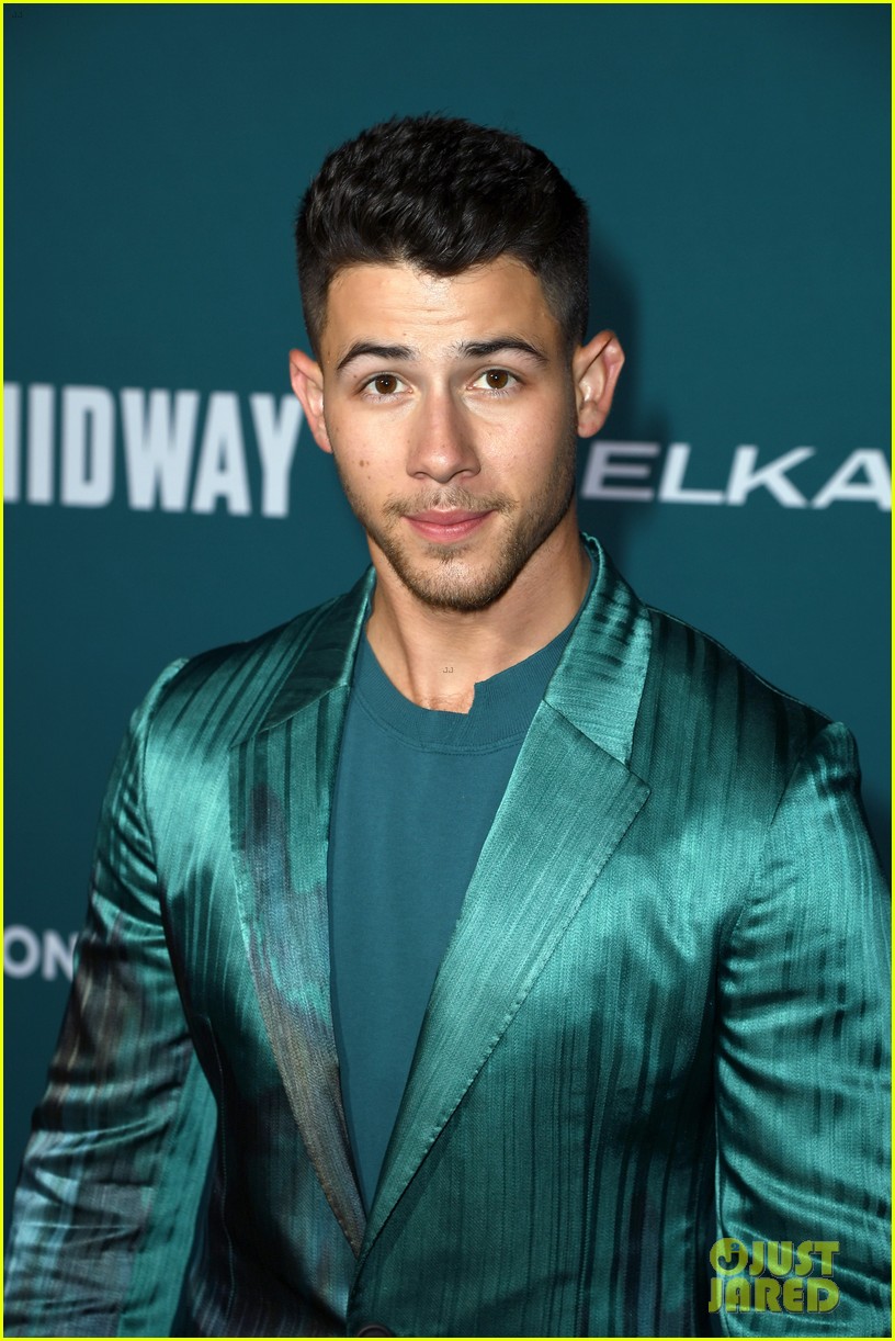 nick jonas sports silk teal suit for midway premiere 12