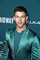 nick jonas sports silk teal suit for midway premiere 08