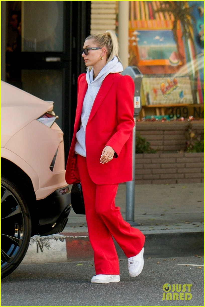 hailey bieber red suit dog ruins tree 04