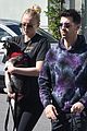 sophie turner holds dog porky in front of baby bump 04