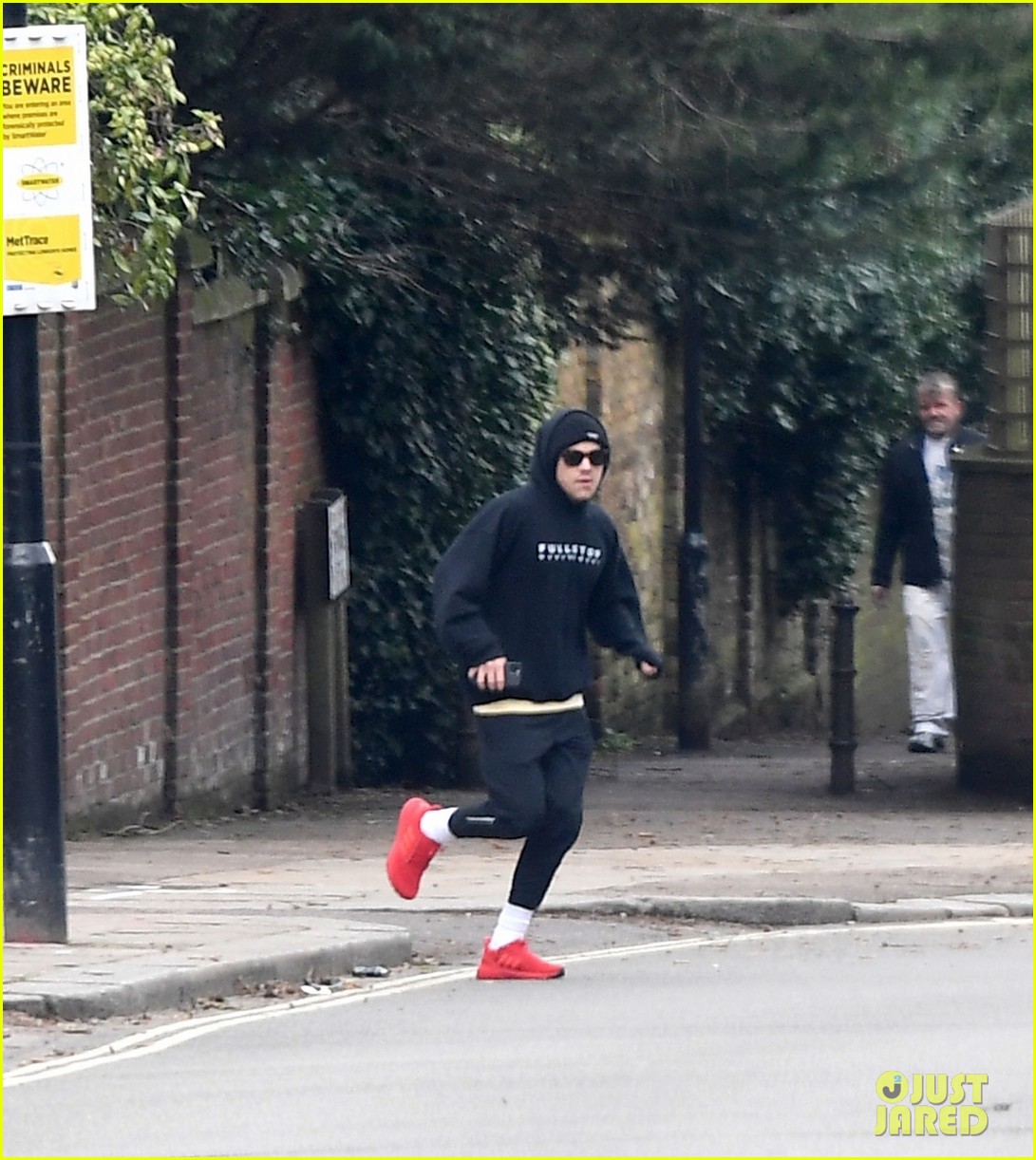 harry styles bundles up for a jog in london 03