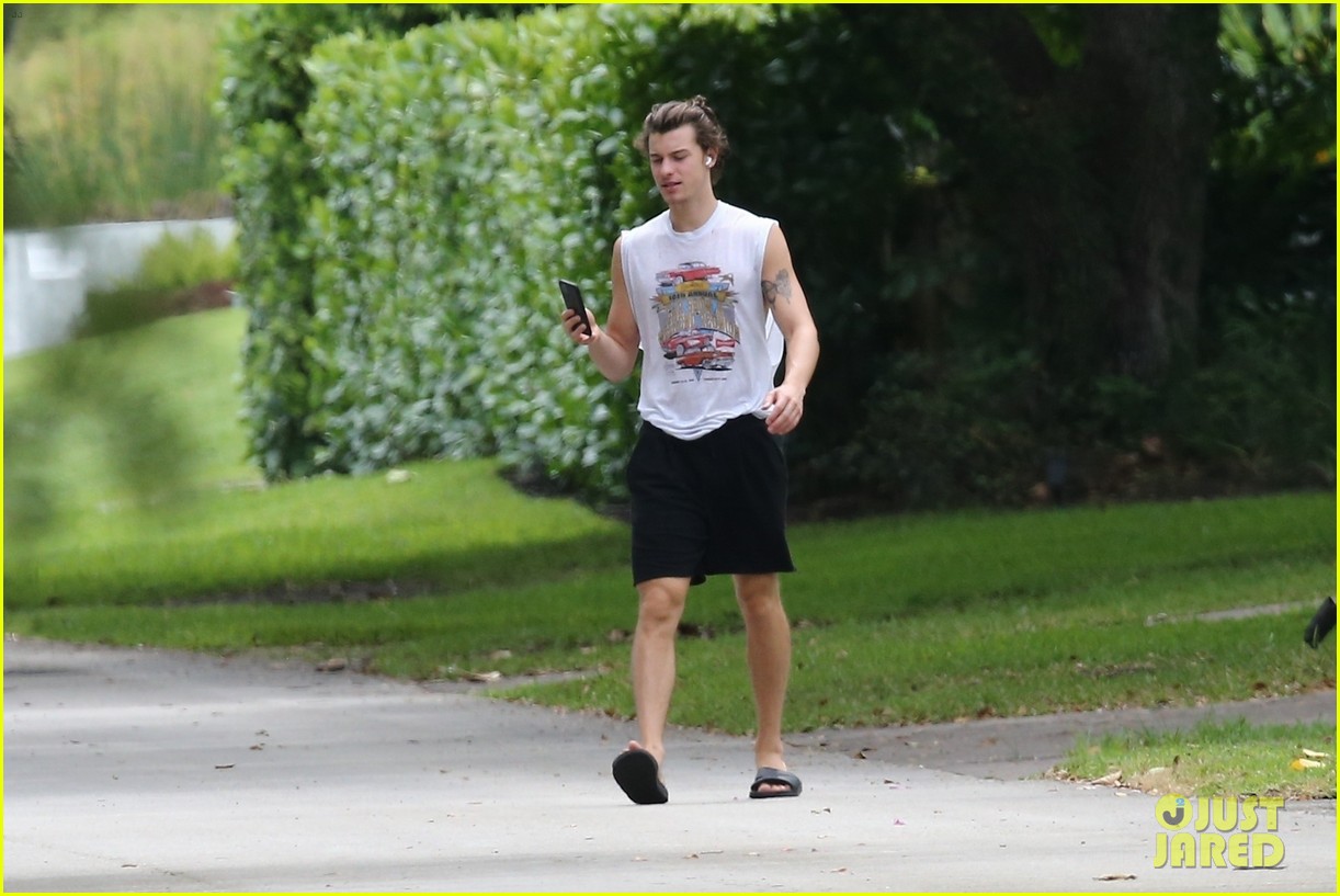 shawn mendes takes a call during his neighborhood stroll 03