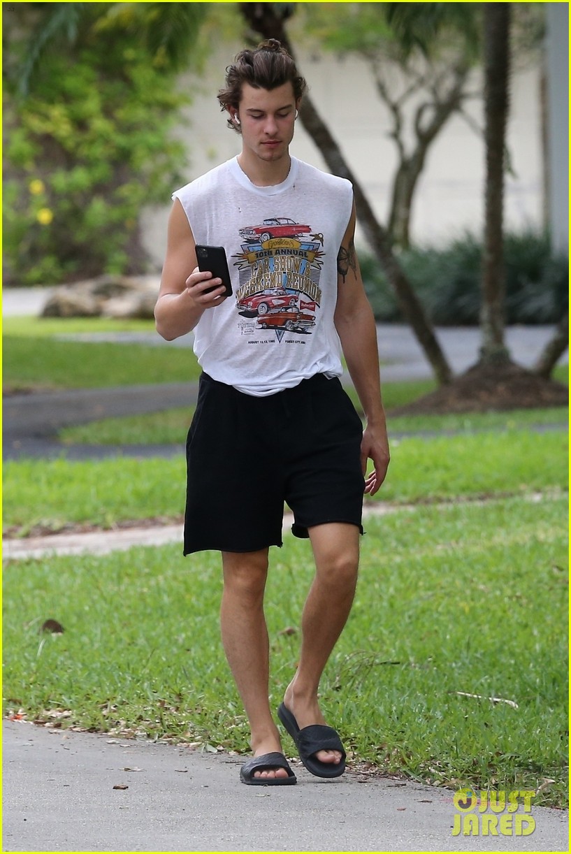 shawn mendes takes a call during his neighborhood stroll 18