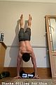 tom holland shows off muscular body while putting on a shirt while doing handstand 03