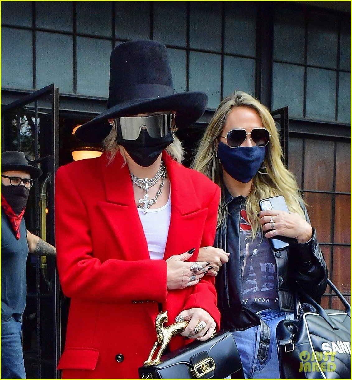 miley cyrus tophat red coat leaving hotel mom nyc 07