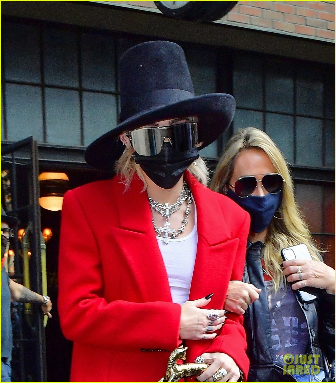 miley cyrus tophat red coat leaving hotel mom nyc 09