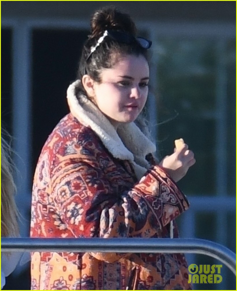 selena gomez boards a yacht for quick trip with friends 02