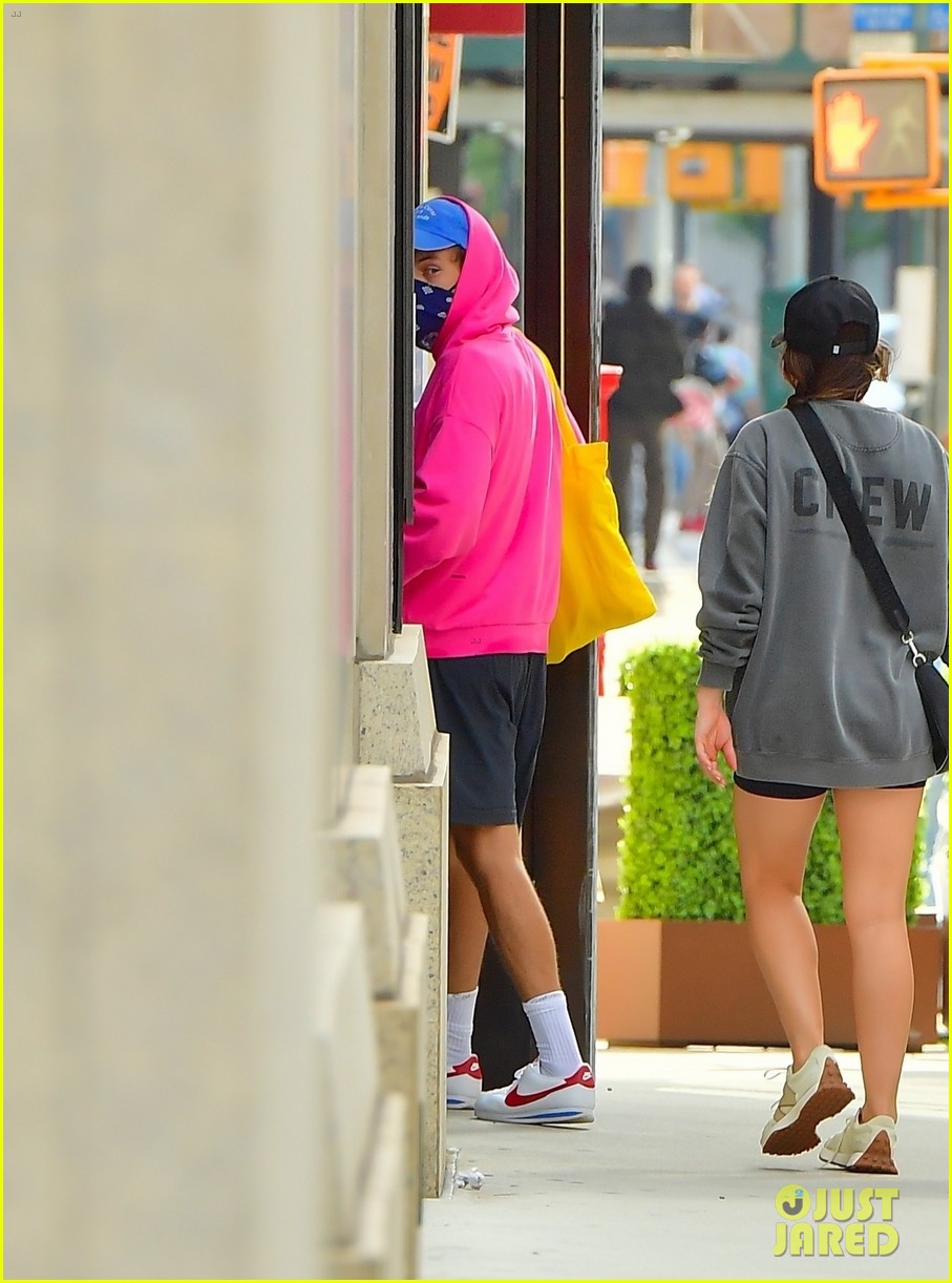 harry styles sports bright pink hooding while hanging out with friends 11
