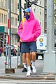 harry styles sports bright pink hooding while hanging out with friends 01