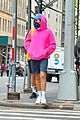 harry styles sports bright pink hooding while hanging out with friends 03