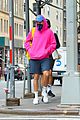 harry styles sports bright pink hooding while hanging out with friends 09