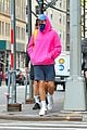 harry styles sports bright pink hooding while hanging out with friends 10