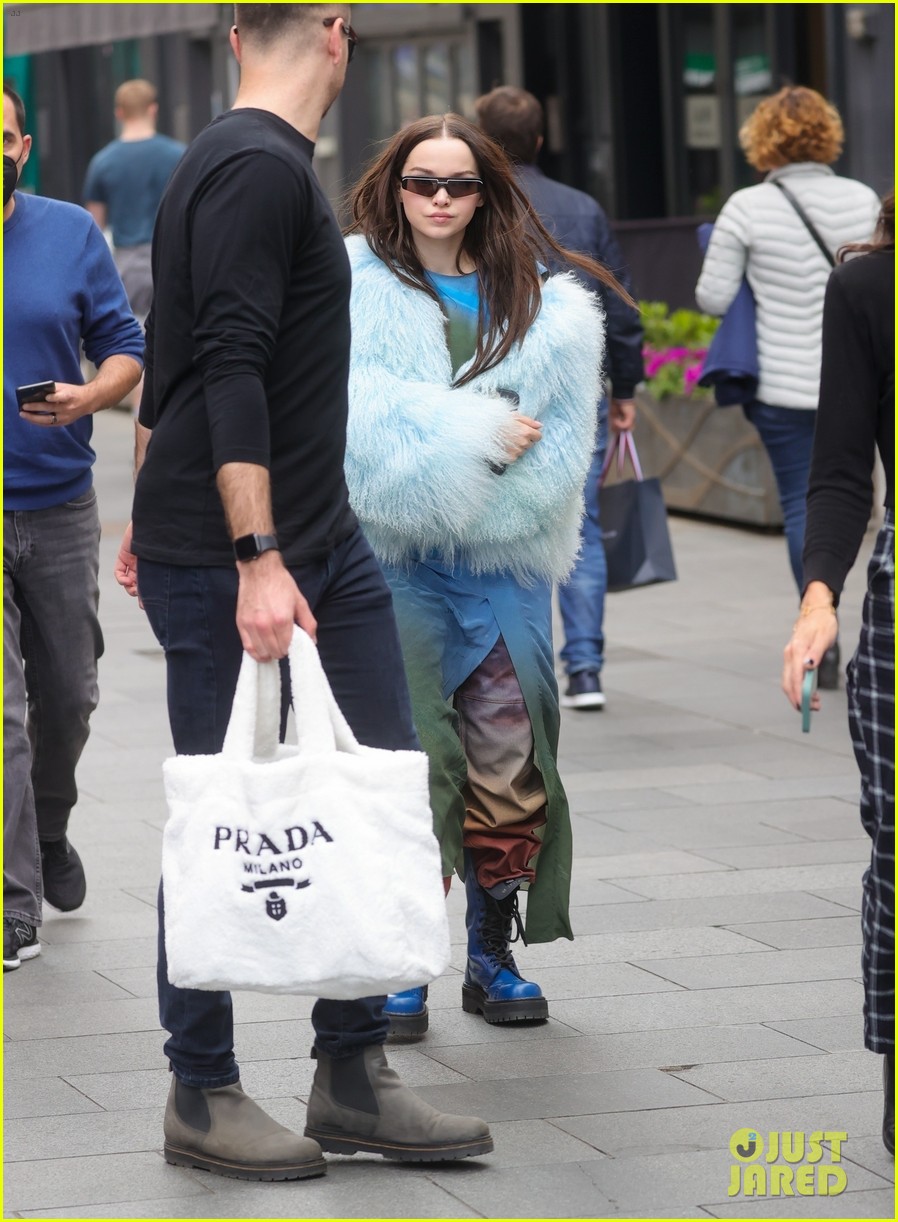 dove cameron wears fluffy blue jacket while out in london 03